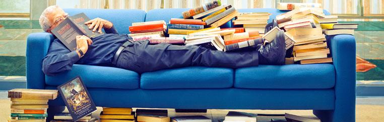 Teacher with books all over.